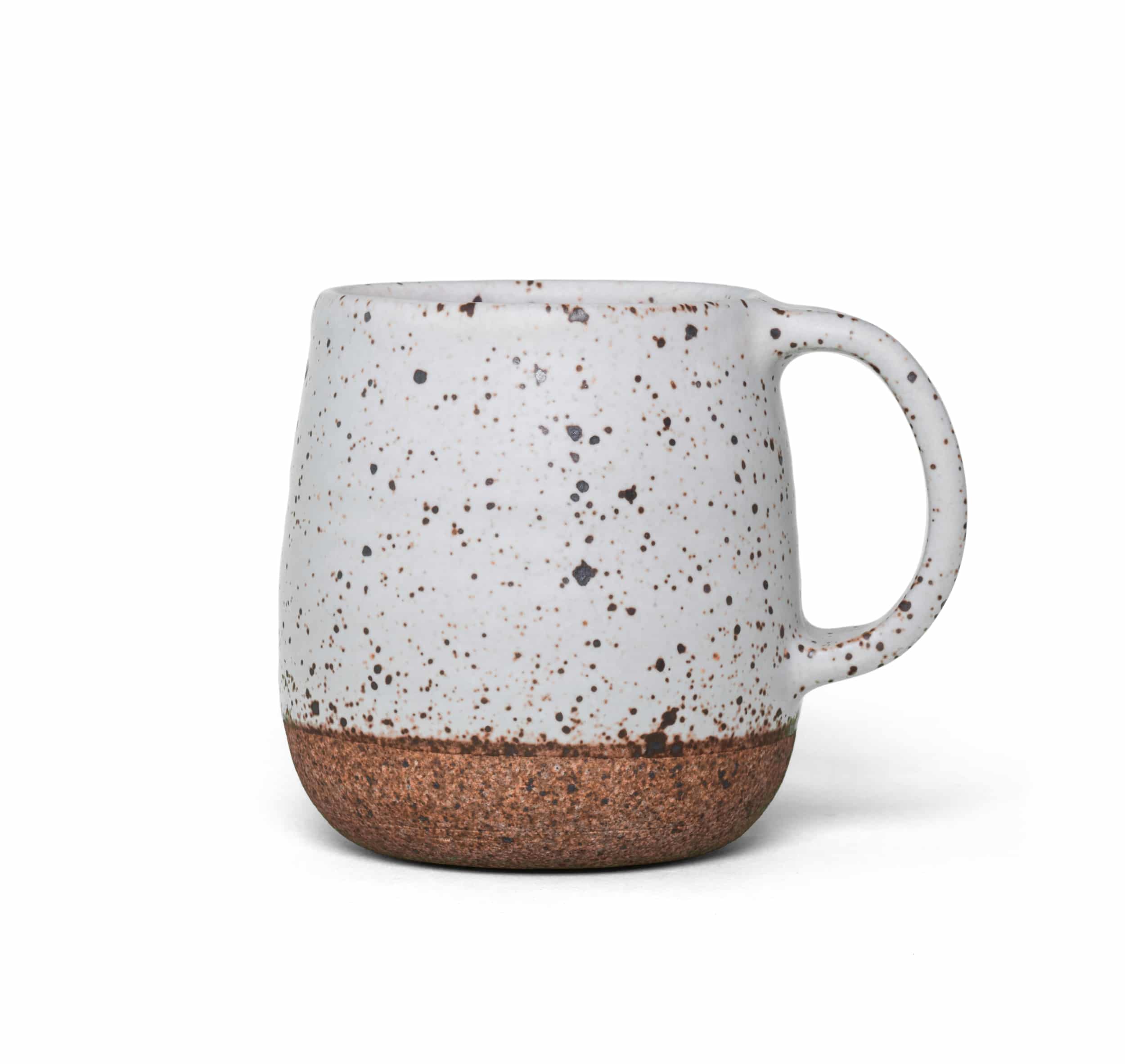 A speckled white ceramic mug designed for chai, highlighting its unique pattern and smooth finish.