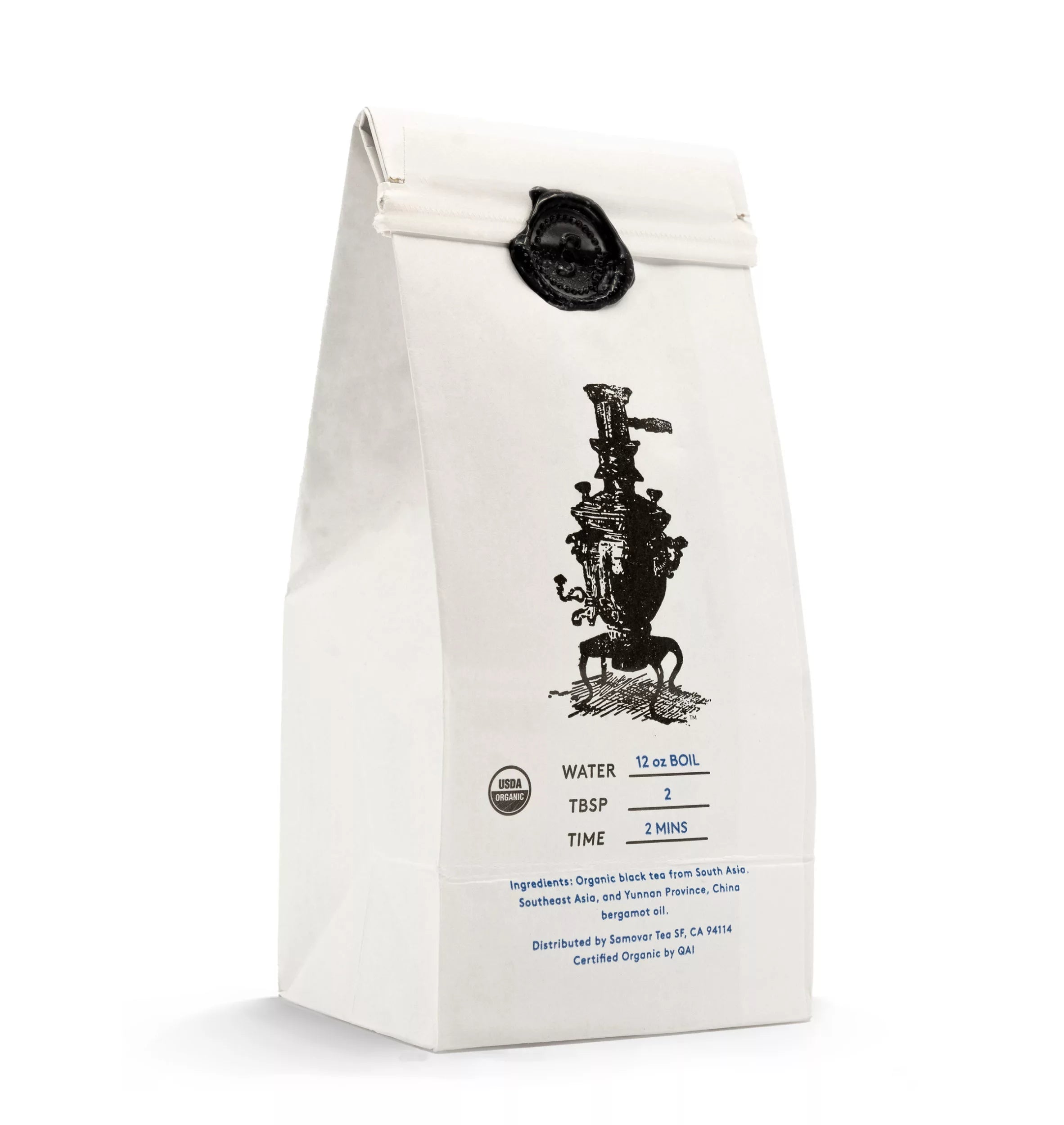 A bag of Earl Grey tea resting on a white surface, highlighting its elegant packaging and branding.